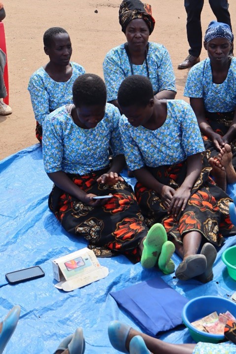 The Tilimbe digital savings group during a savings meeting.